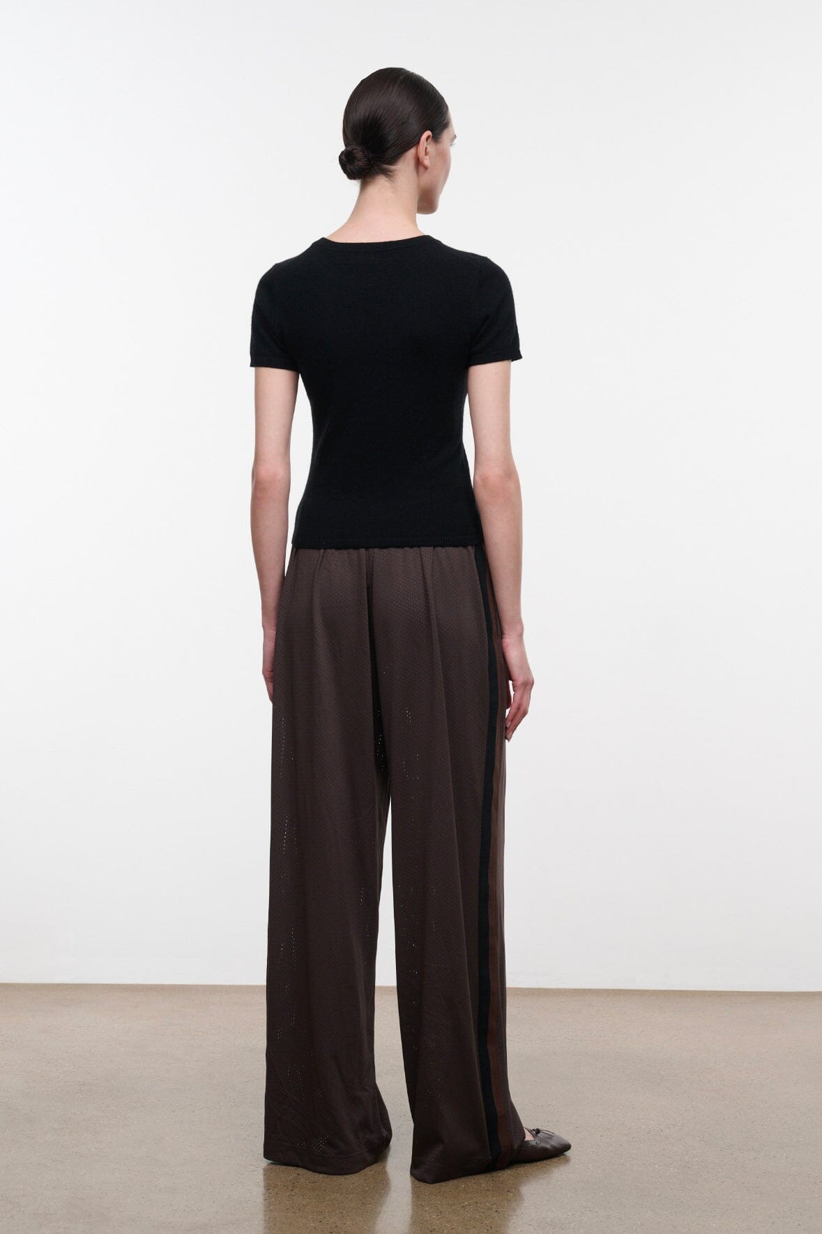 Dark oak wide-leg pants with relaxed fit and elastic waistband, back view