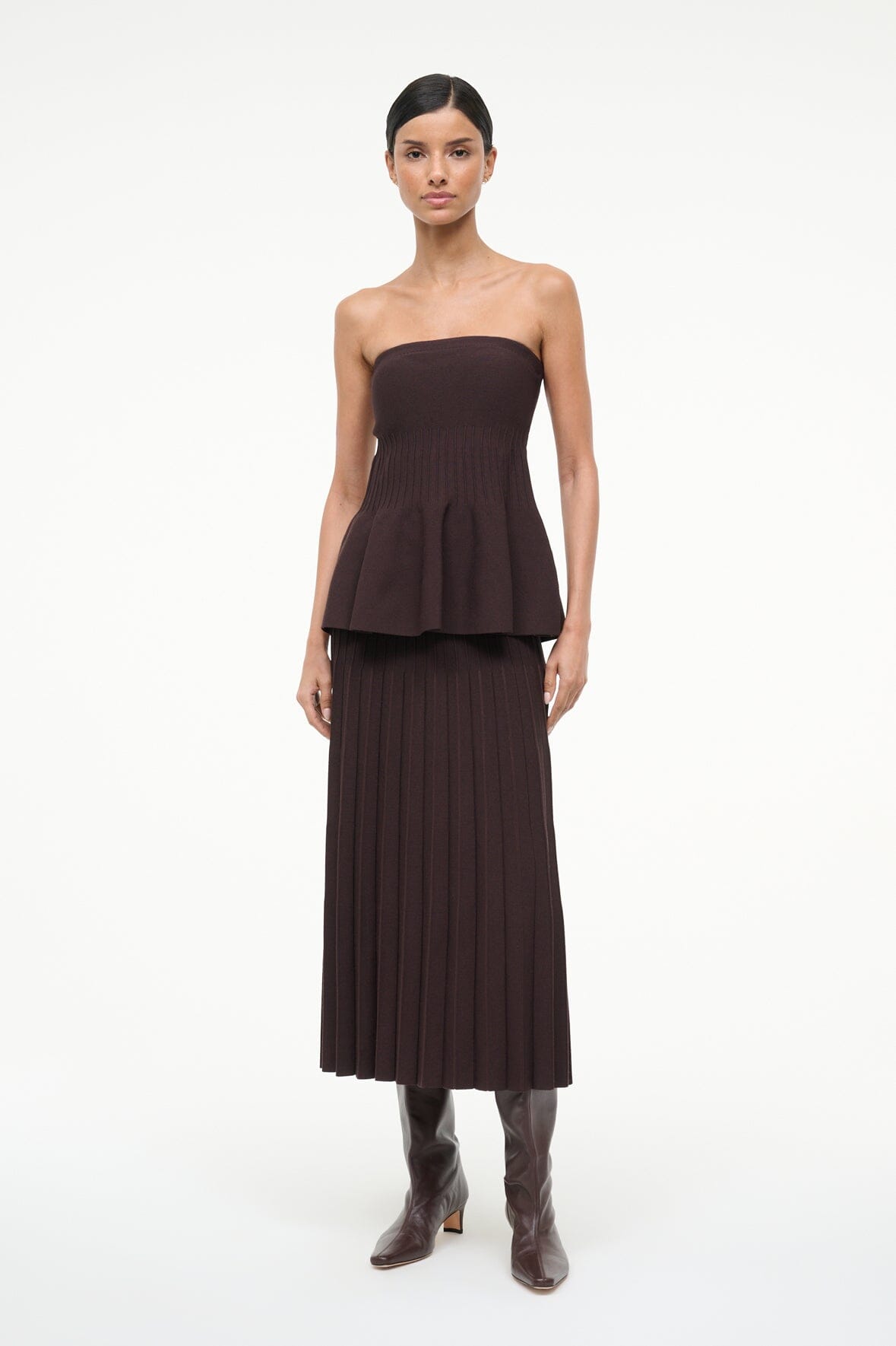 Espresso brown tall heeled boots with pointed toe shown with a peplum dress