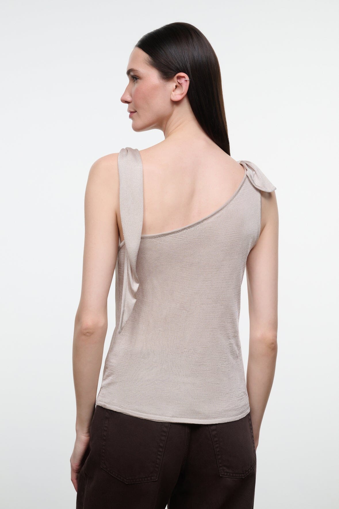 Back view of women's champagne sleeveless cowl-neck top with open scoop back