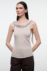 Front view of women's champagne sleeveless cowl-neck fitted top with draped neckline