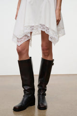 Pair of espresso tall boots with buckle straps and low block heels