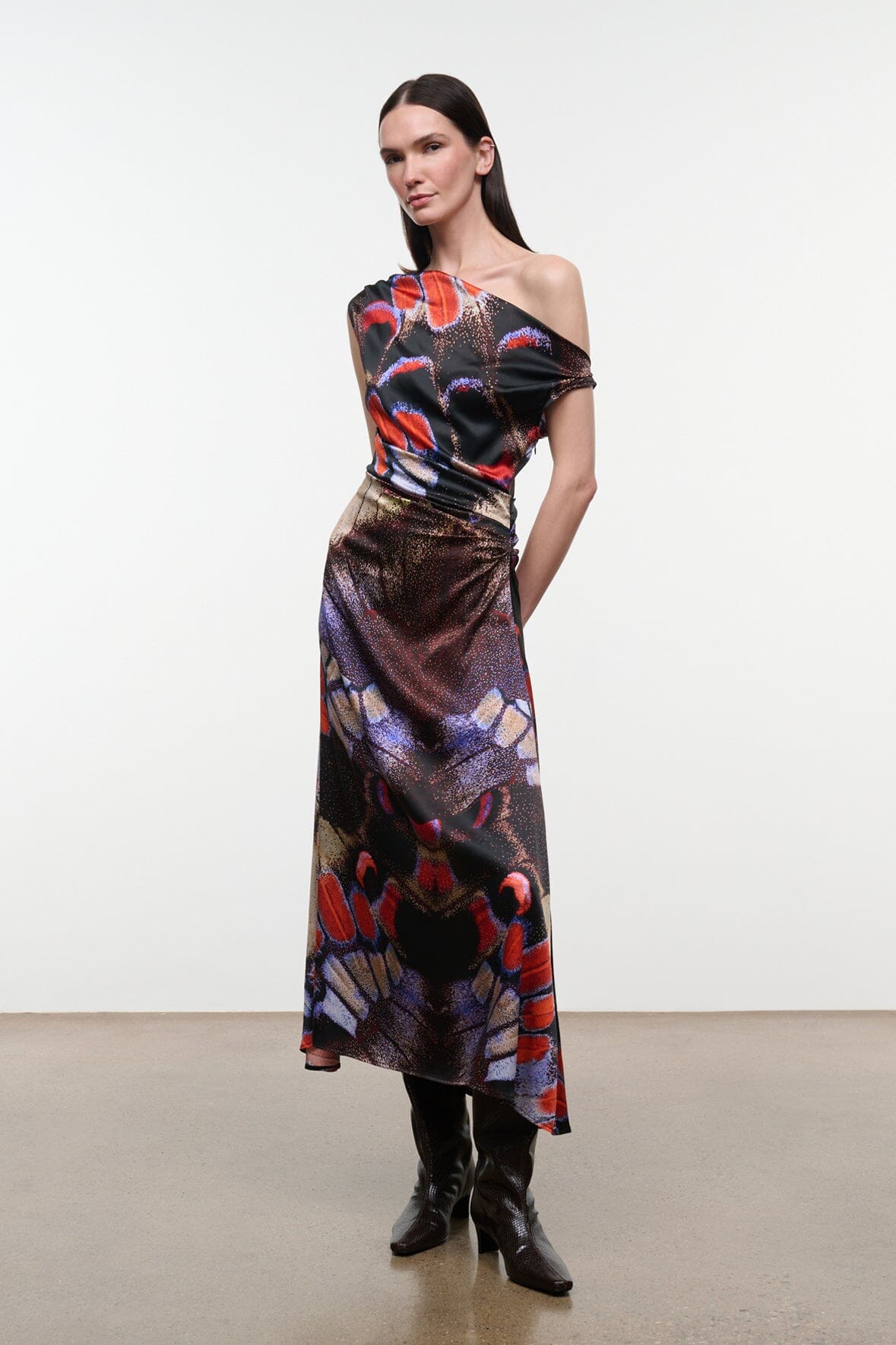 One-shoulder silk midi dress with flowing skirt and dark butterfly pattern