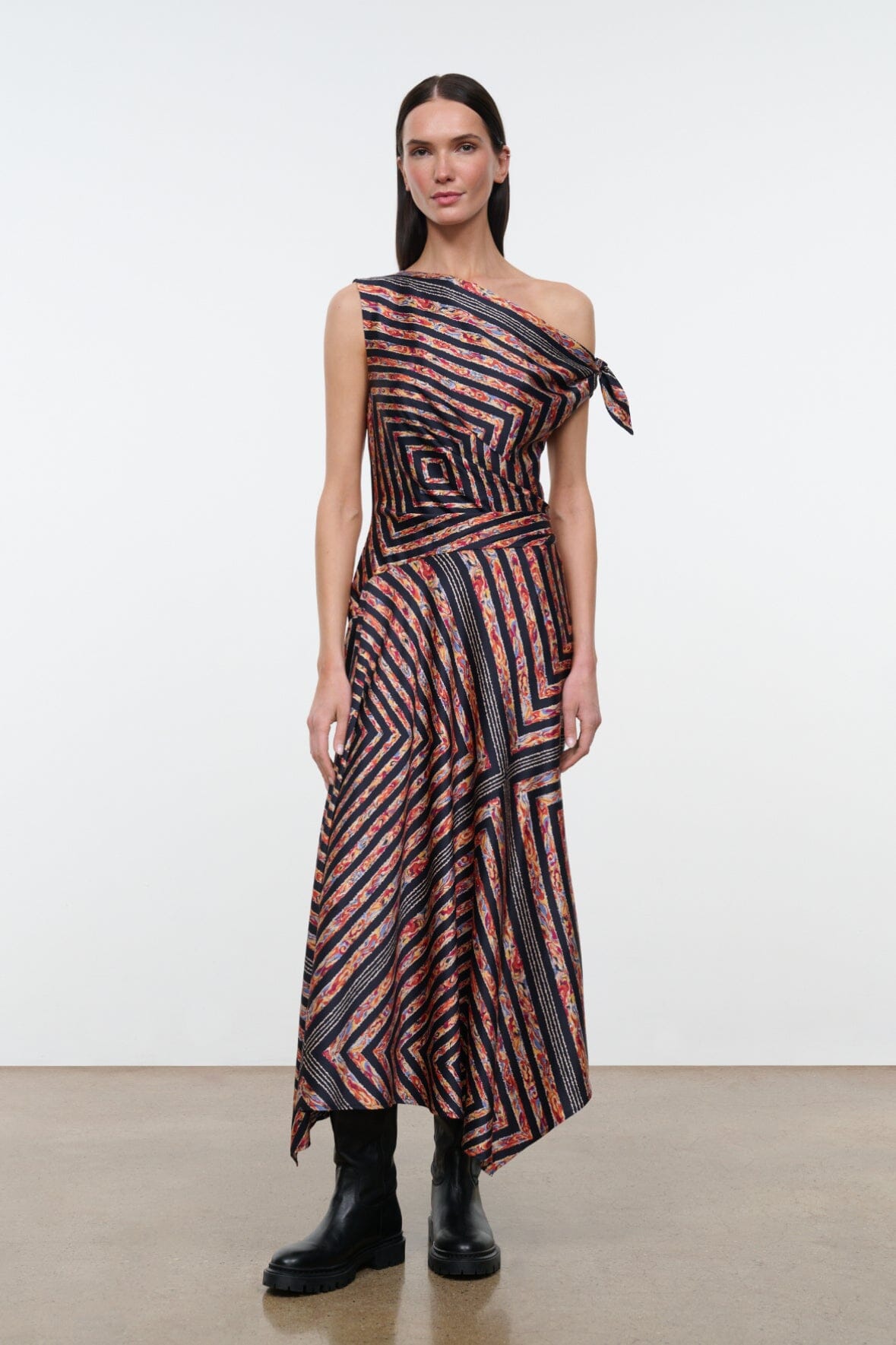 One-shoulder silk dress with tie detail, black rust and cream geometric stripe print