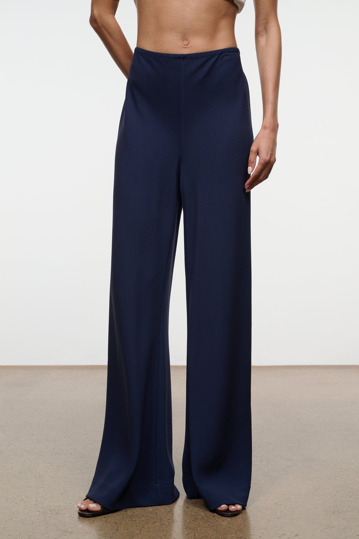 Navy wide-leg pants with gathered elastic waistband and wide straight legs