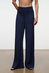 Navy wide-leg pants with gathered elastic waistband and wide straight legs