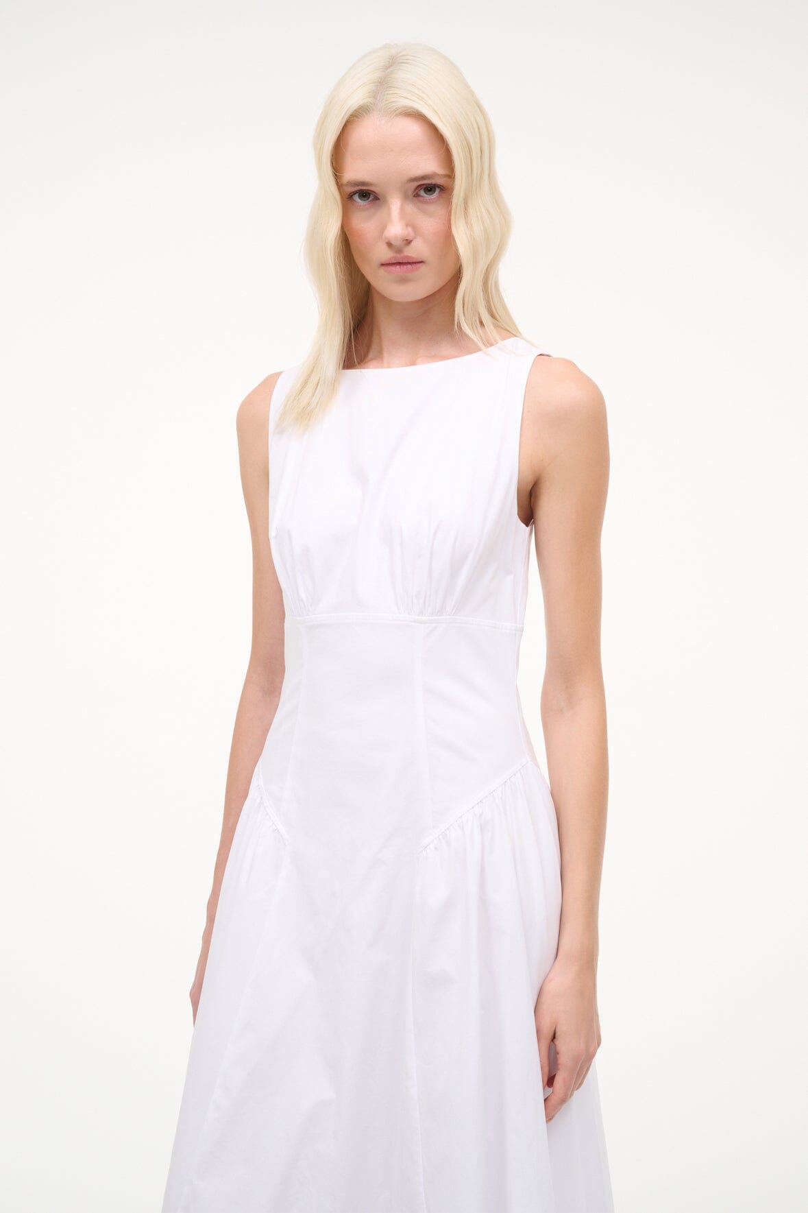 White sleeveless midi dress with scoop neckline and cinched waist