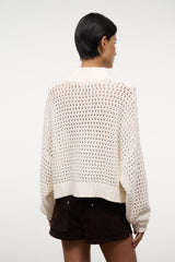 Cropped Hampton sweater, back view in ivory knit with horizontal stitch rows.