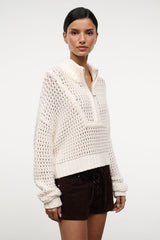 Cropped Hampton sweater in ivory knit with zip-front collar and textured pattern.