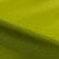 Lime green textured fabric close-up with smooth matte finish