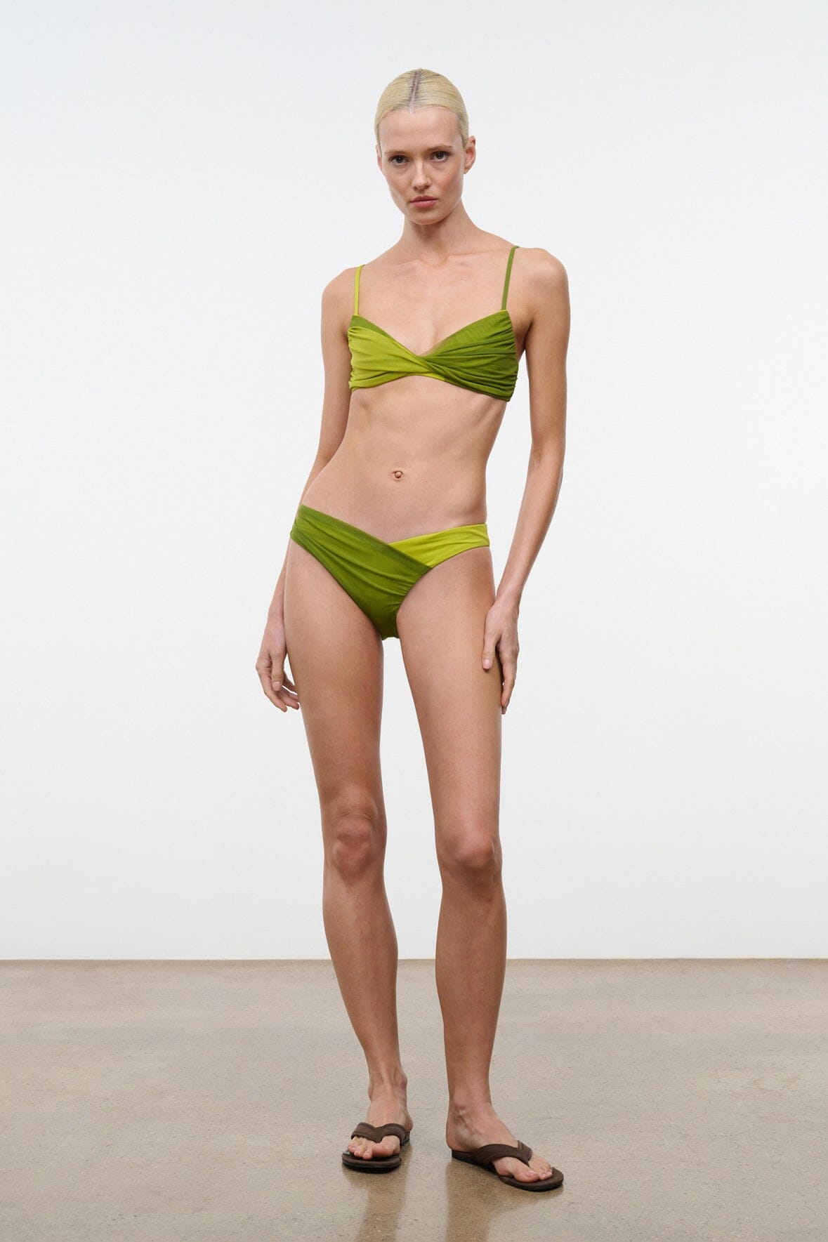 Lime green bikini bottom with ruched waistband and high-cut leg