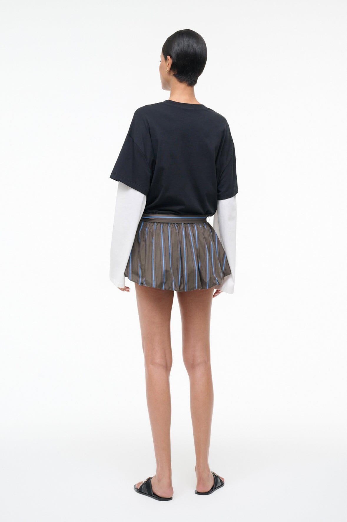 Back view of striped pleated drawstring skirt with vertical blue and gray stripes