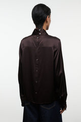 Back view of earth-brown silk top with stand collar and button placket