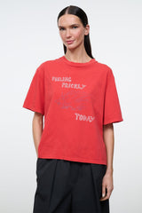 Relaxed red T-shirt with graphic text 'FEELING PRICKLY' and 'TODAY' on front