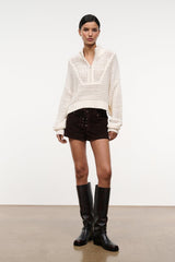 Cropped Hampton sweater in ivory knit, quarter-zip style with loose cropped fit.