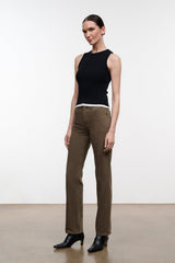 Greige straight-leg jeans on model with button fly, belt loops, and ankle hem