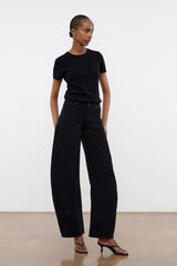 Black barrel jeans with front pockets and cuffed hem, relaxed fit