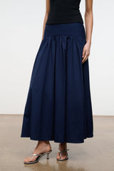 Navy pleated midi skirt with elastic waist and full swaying A-line hem