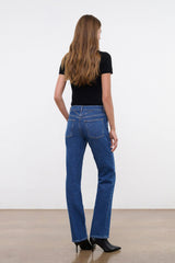 Stone blue straight stretch jeans on model, back view, mid-rise