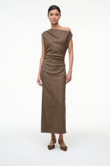 Truffle-brown suede slingback heels on feet with long brown dress