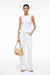 White sleeveless peplum top with round neckline and smocked waist ruffle hem
