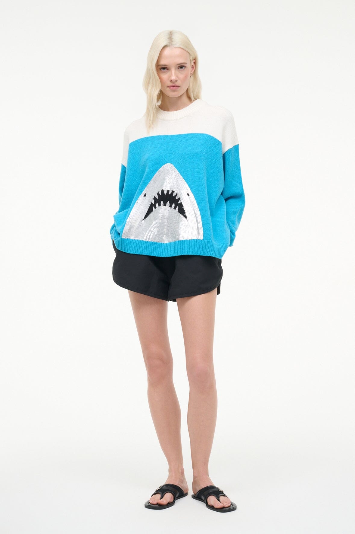 Crewneck sweater with oversized shark graphic, blue knit body and white stripe
