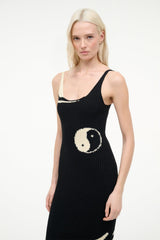 Black ribbed midi dress close-up with spaghetti straps and ivory yin-yang motif