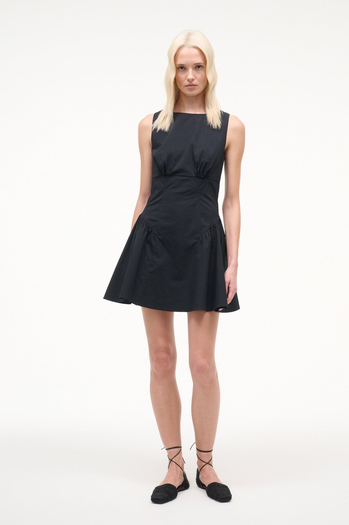 Black sleeveless mini dress with scoop neckline, gathered waist, A-line skirt