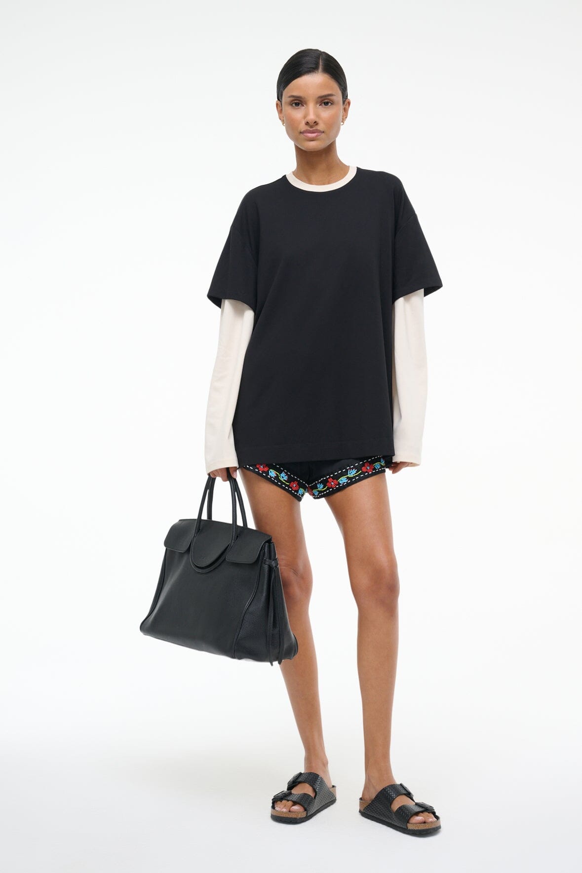 Black oversized T-shirt with ecru side panels and embroidered trim at the hem