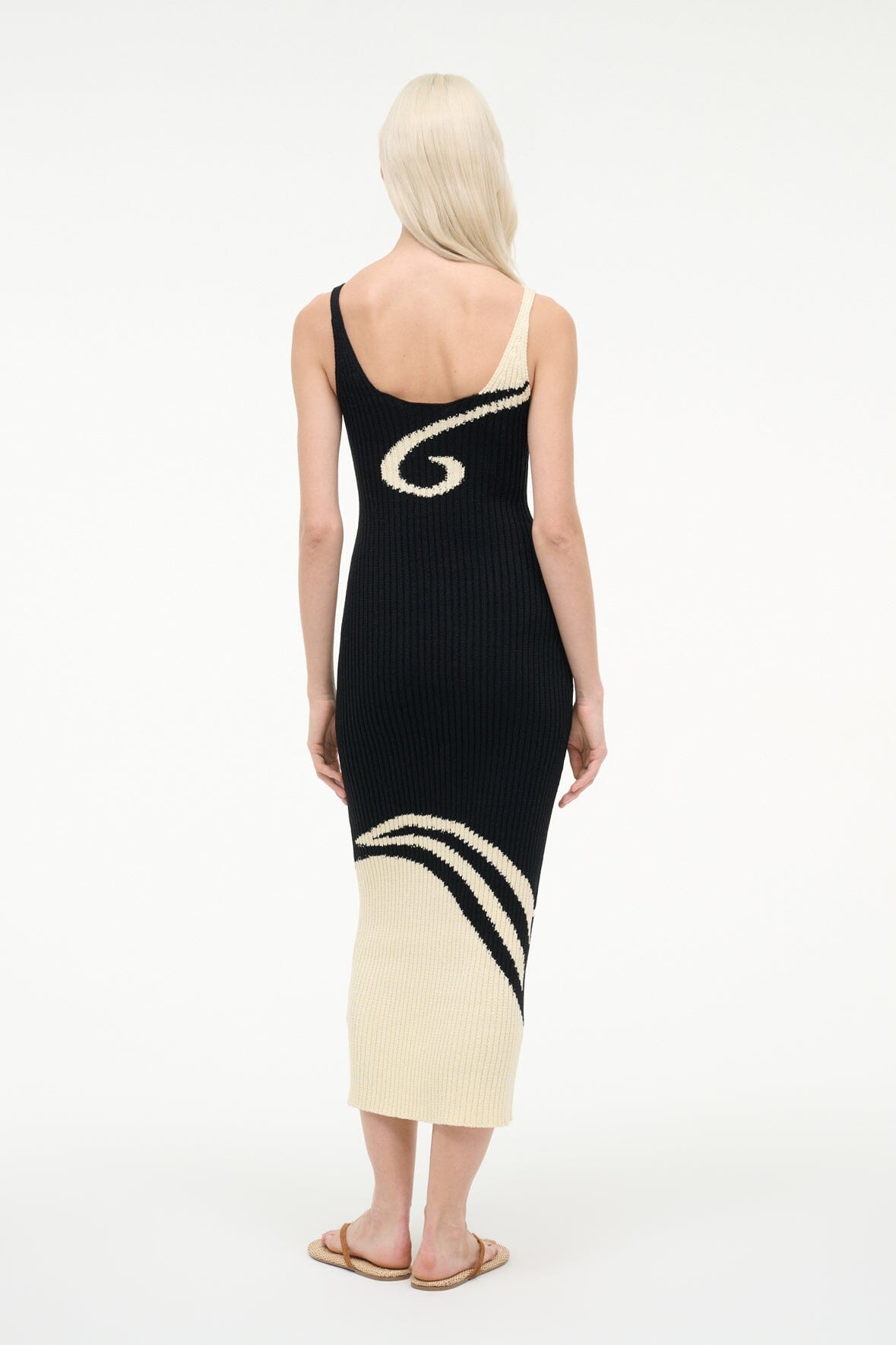Back view of ribbed black midi dress with spaghetti straps and ivory yin-yang design