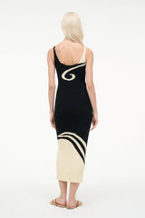 Back view of ribbed black midi dress with spaghetti straps and ivory yin-yang design