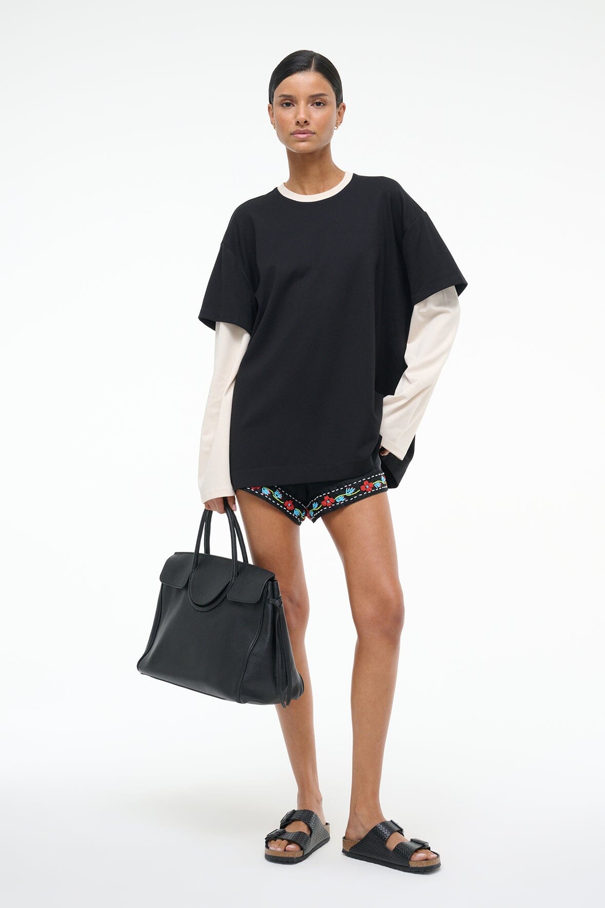 Black oversized T-shirt with ecru side panels and embroidered hem trim