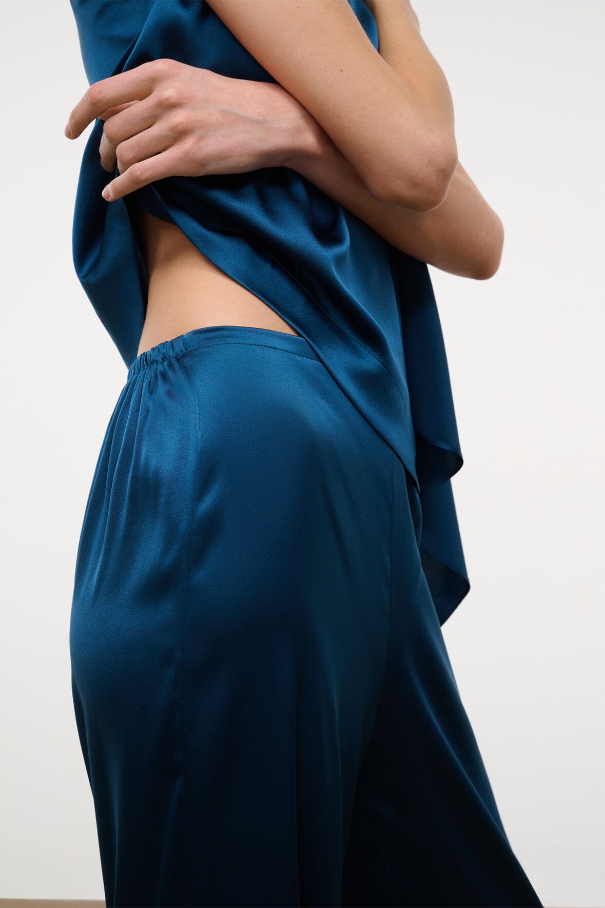 Blue silk wide-leg pant with elastic waist and side drape detail