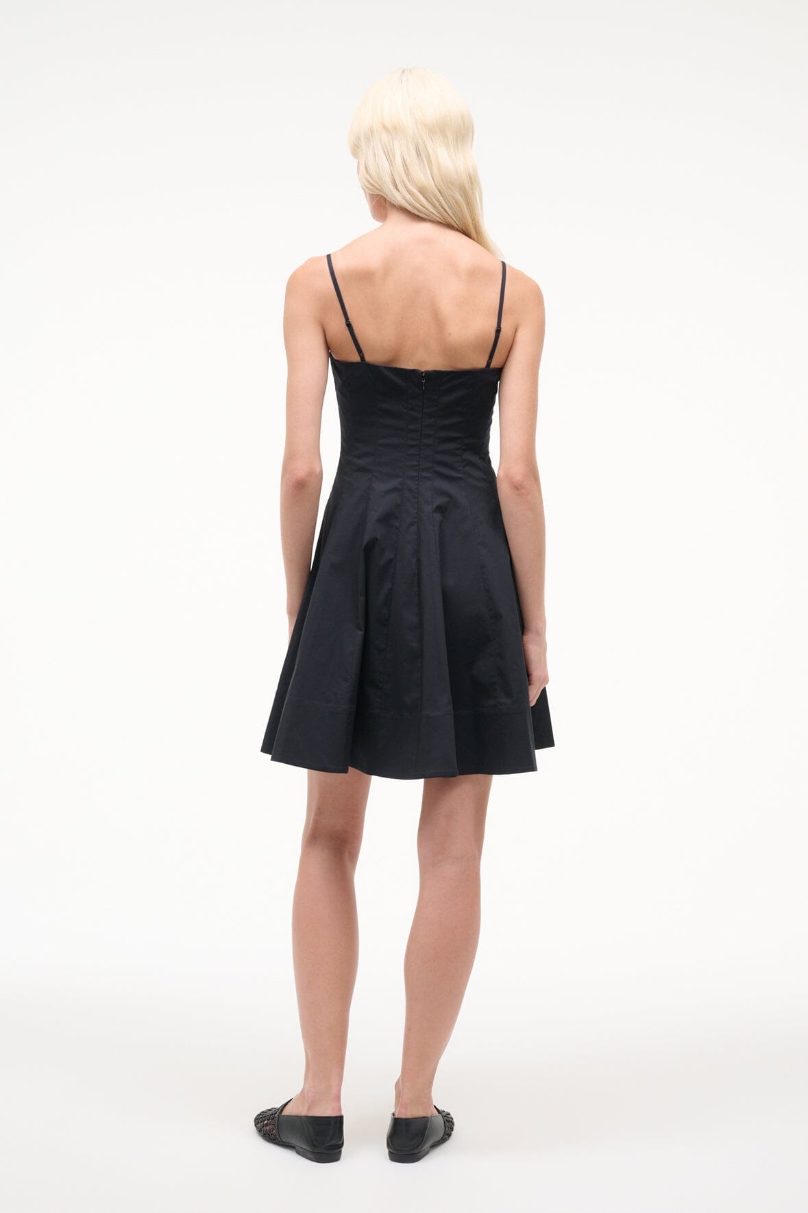 Black mini dress back view with spaghetti straps and flared skirt