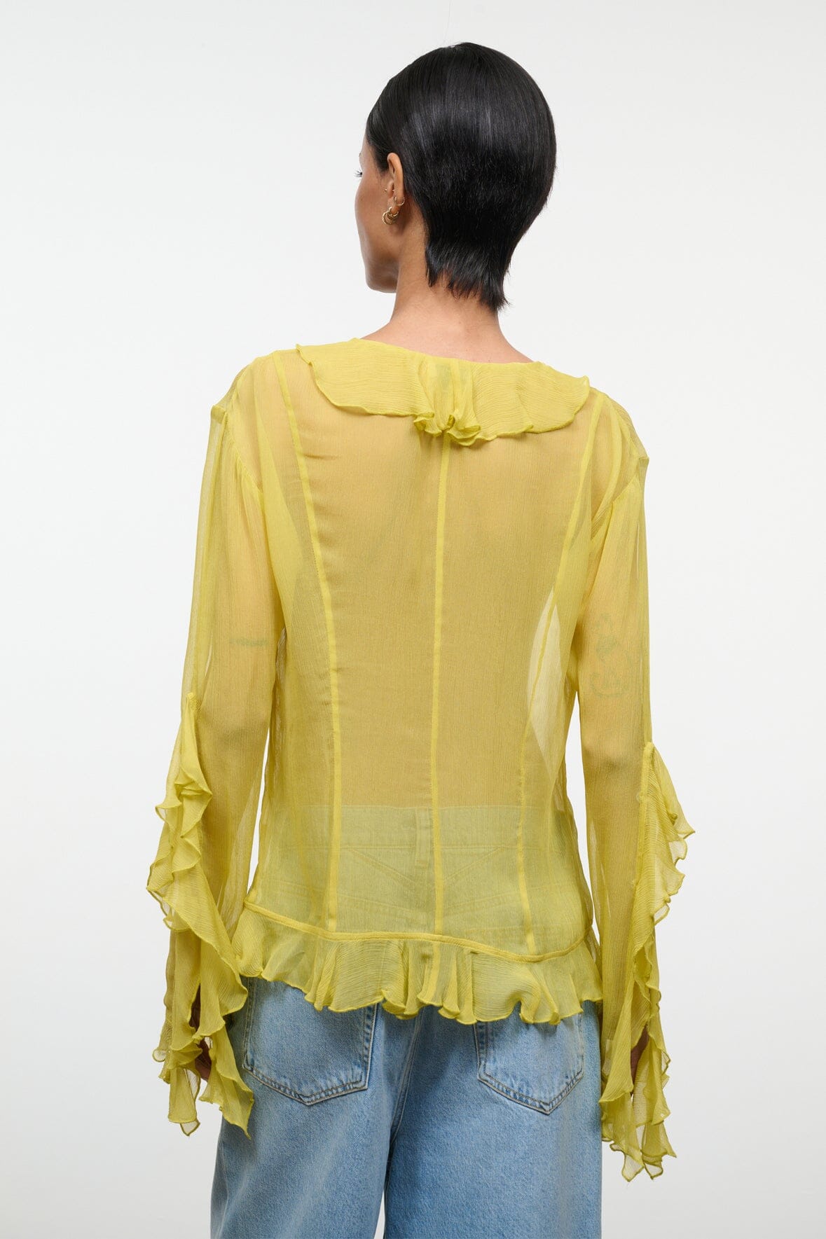 Citron ruffle back top with shoulder yoke and cascading cuffs