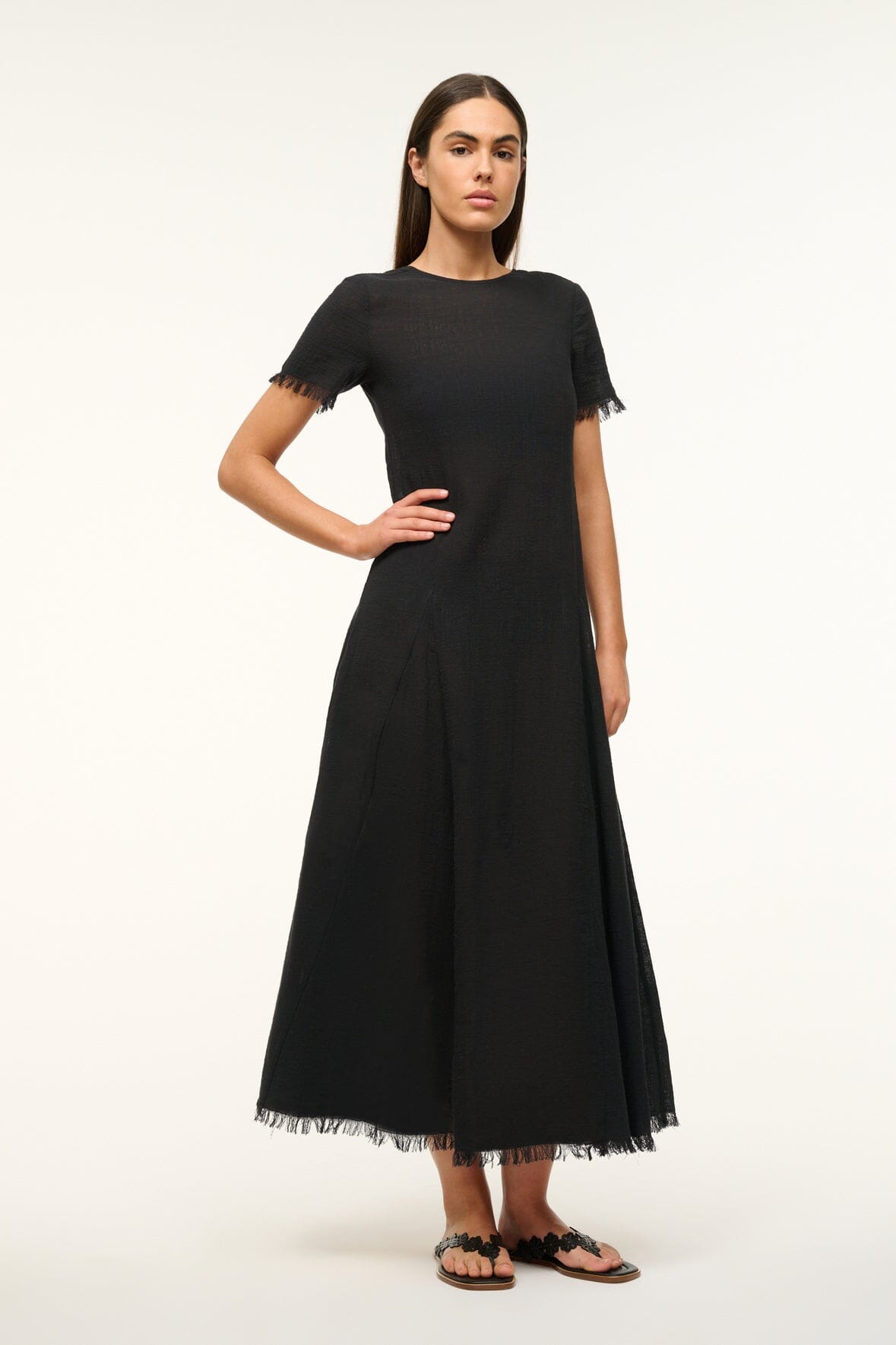 Black long coverup dress with crew neck and fringe sleeve cuffs