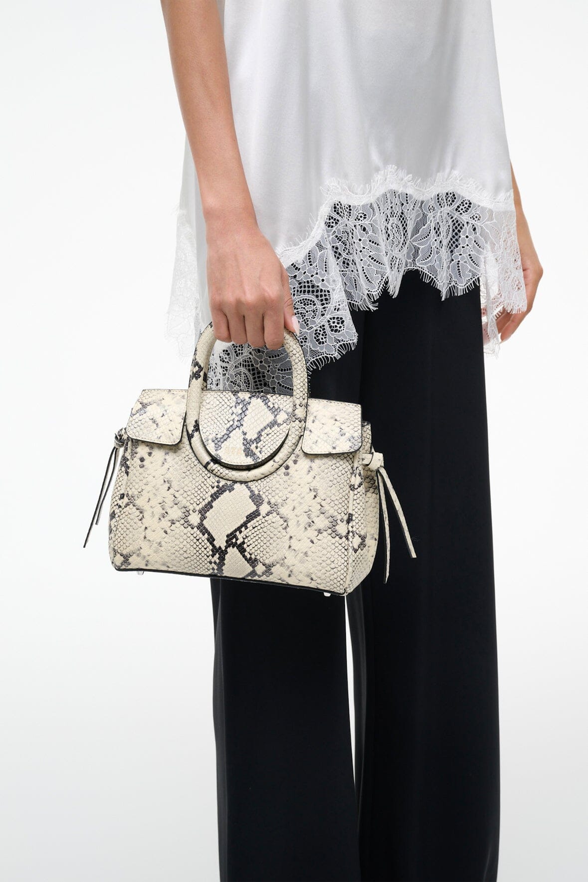 Mini carryall handbag with white snake-embossed pattern and top handle