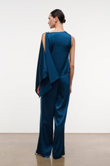Back view of blue silk wide-leg pant with draped overlay at waistband
