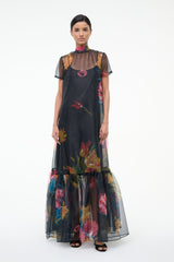 Black floral maxi dress with high neck, short sleeves, and layered tulle hem