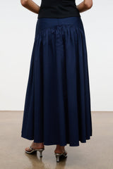 Navy pleated midi skirt with ruched elastic waistband and gathered panels