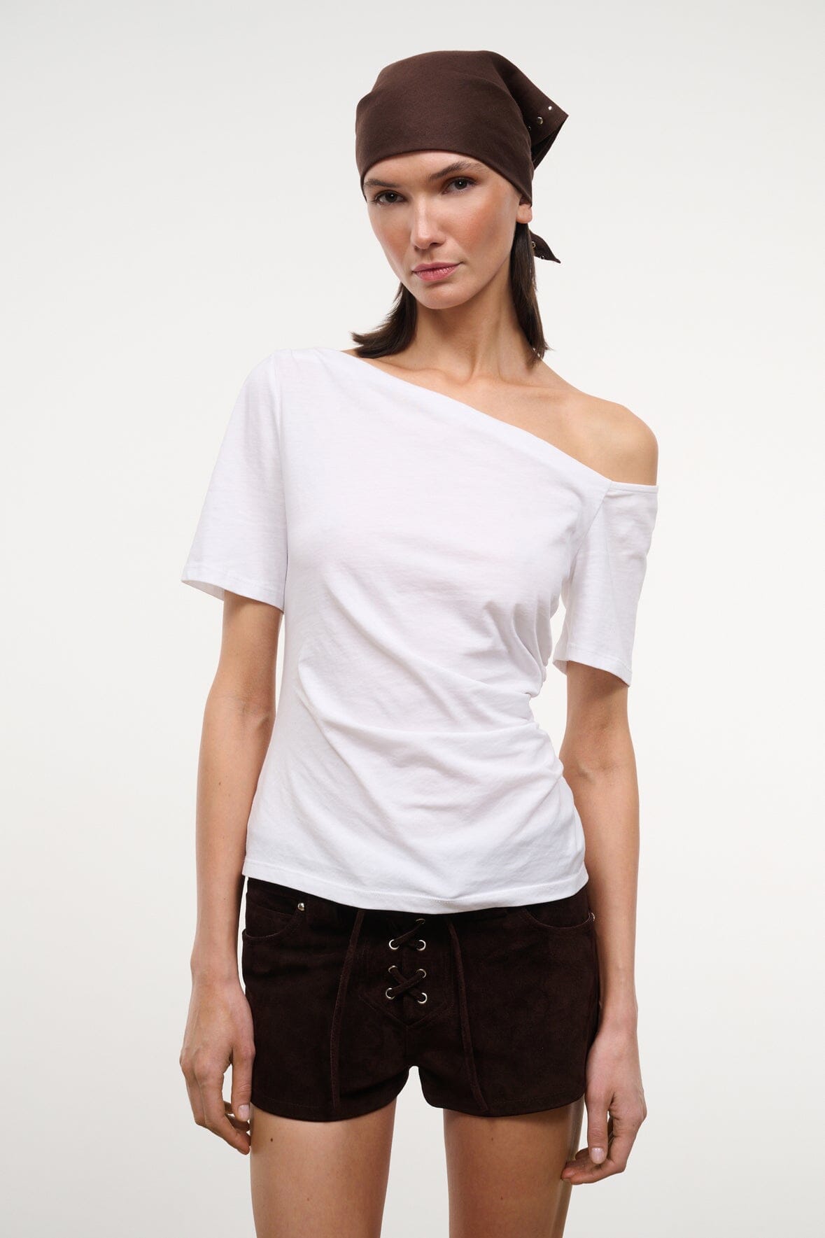 White off-shoulder ruched top with diagonal neckline and short sleeves