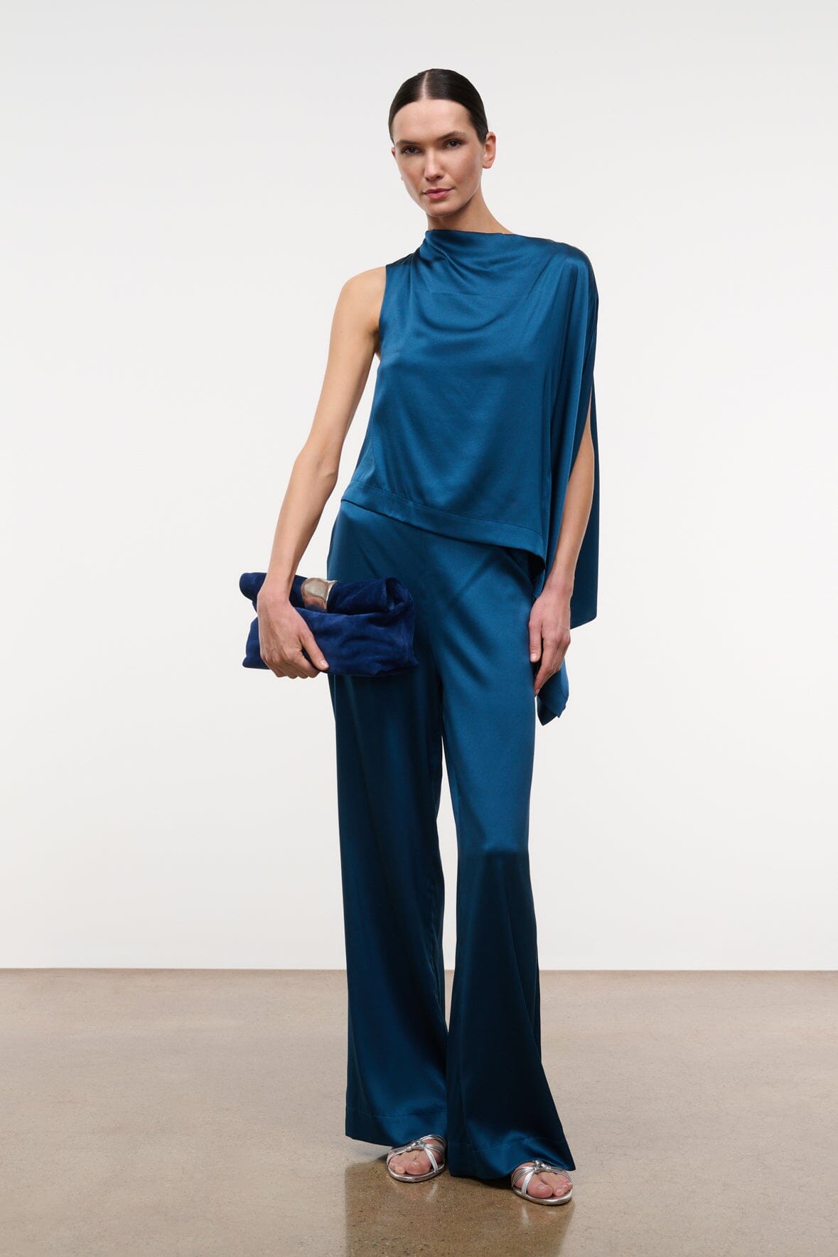 Cobalt suede cuff clutch with silver-tone front clasp