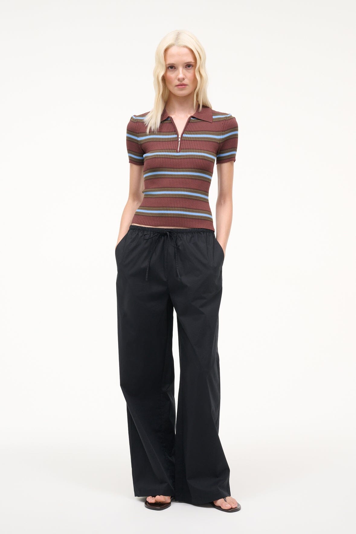 Black wide-leg pants with gathered elastic waist and relaxed straight legs