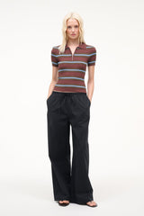 Black wide-leg pants with gathered elastic waist and relaxed straight legs