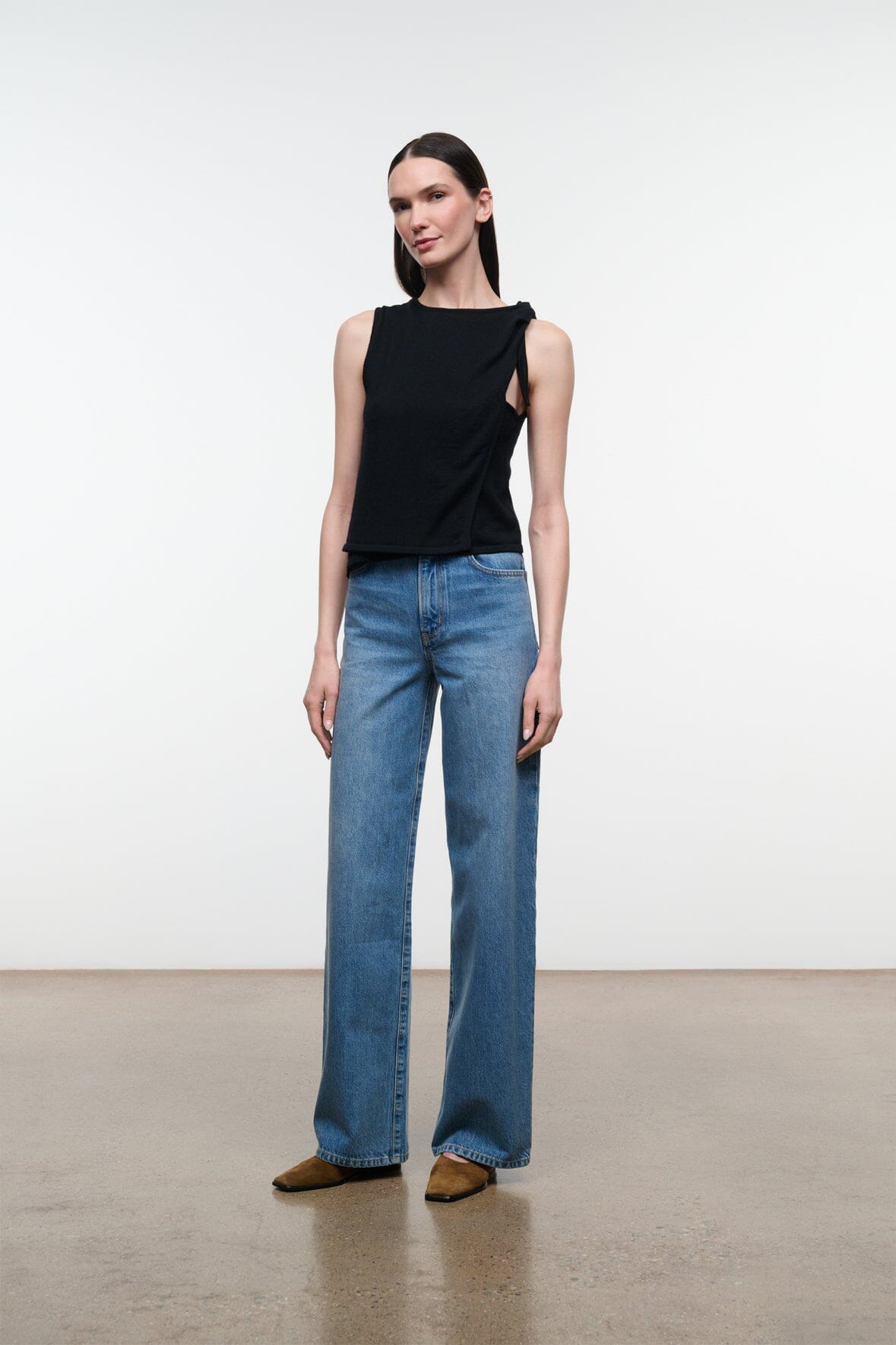 Blue wide-leg denim jeans with straight cut, belt loops, front pockets, mid rise