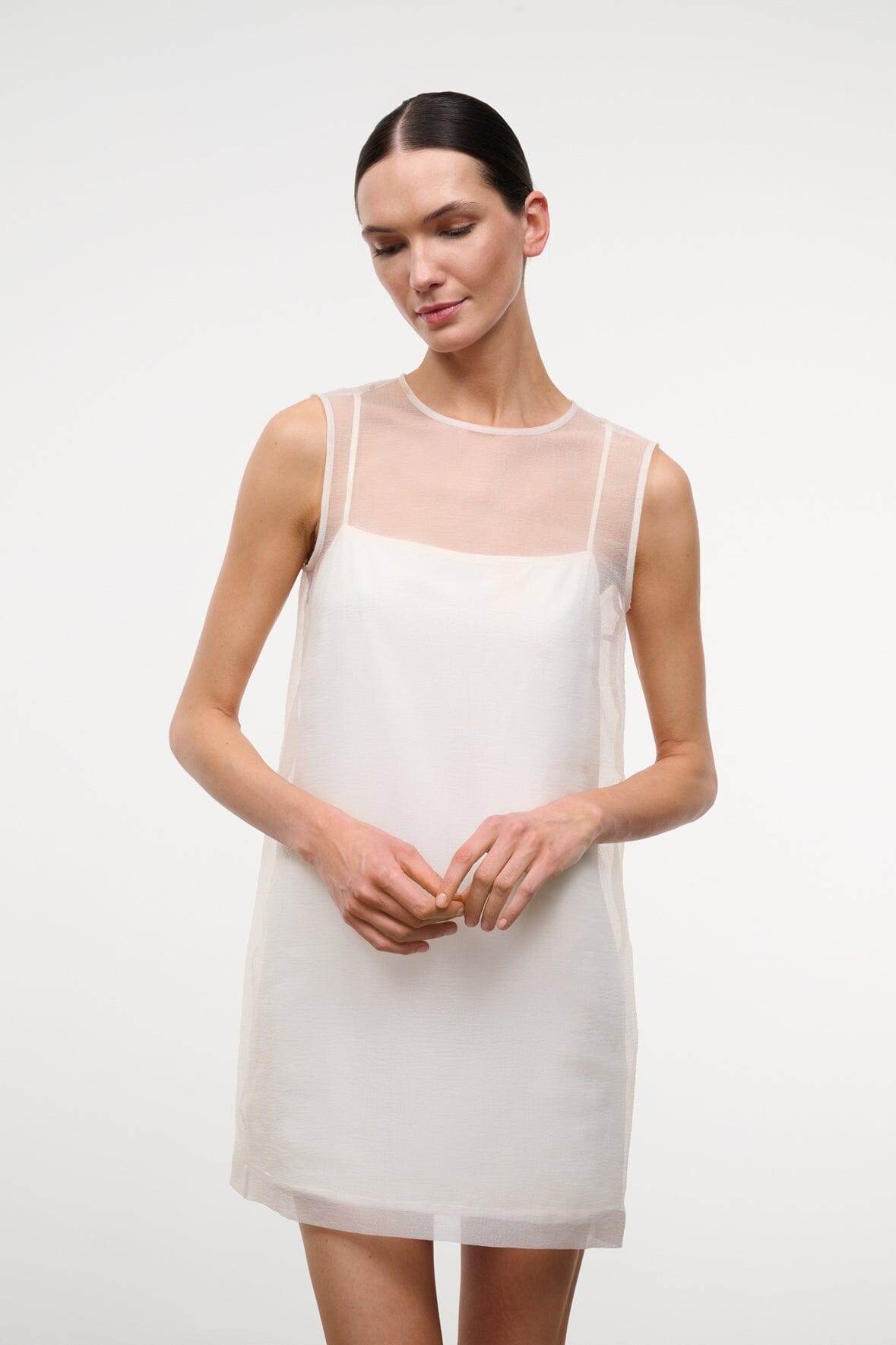 BREA dress in ivory, sleeveless mini shift with round neckline and sheer overlay