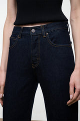 Indigo straight jeans with button-and-zip fly, belt loops, and contrast seam stitching