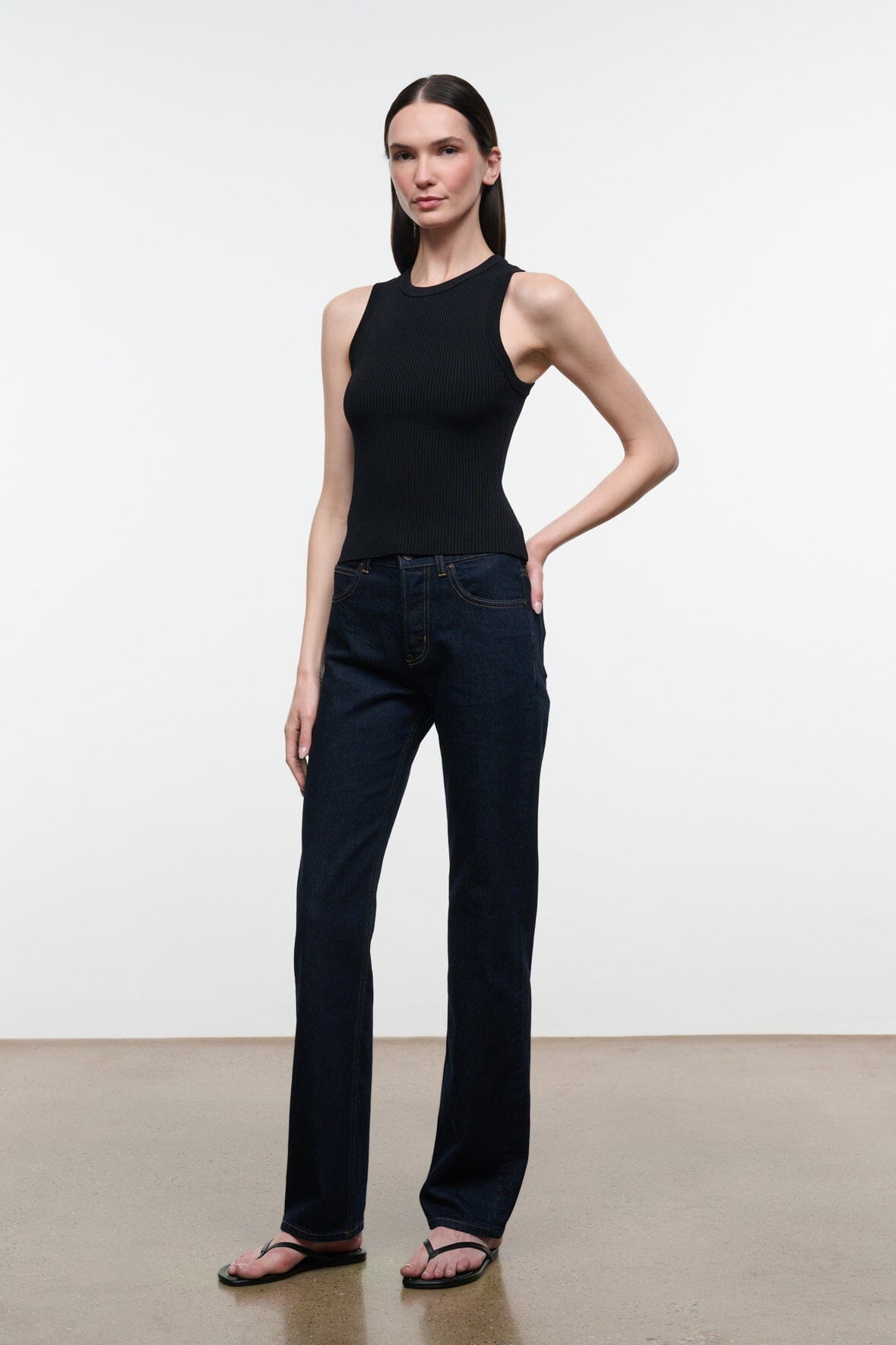 Straight-leg indigo jeans with front slash pockets and button-closure waistband