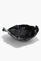 Black glazed wavy ceramic bowl, glossy irregular rim