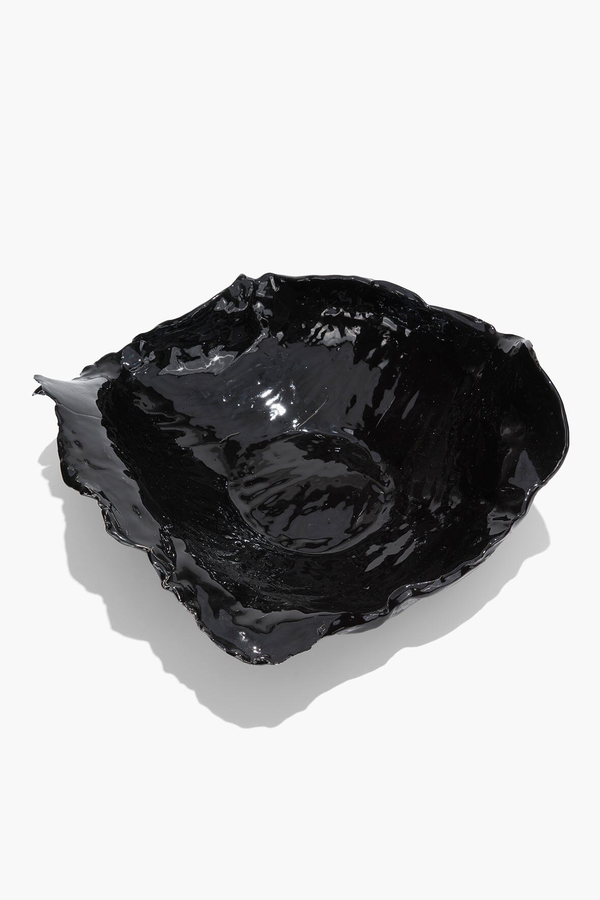 Black glazed wavy ceramic bowl with raised wavy sides and reflective finish