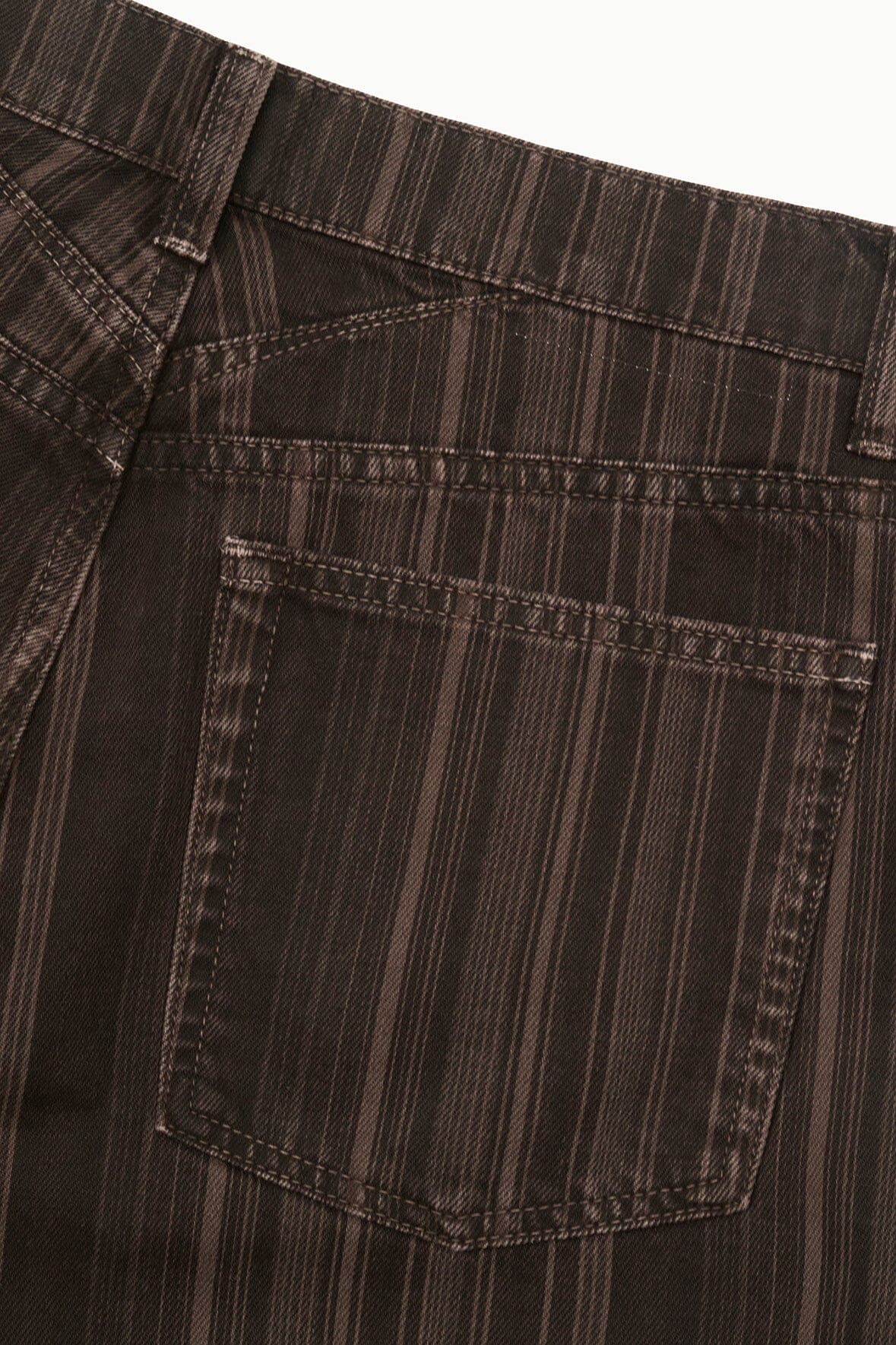 Dark espresso-striped jeans with front patch pocket and visible topstitching